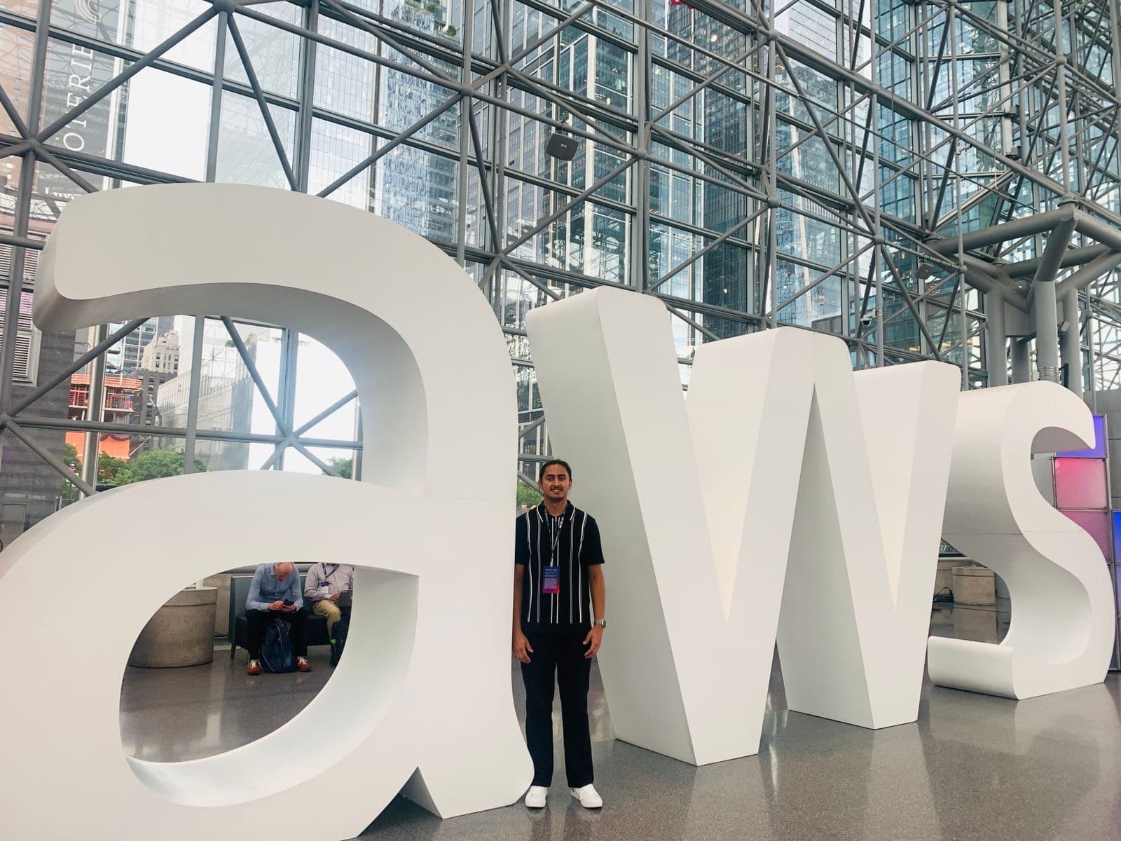 Diwash beside the AWS sign at AWS Summit New York 2026